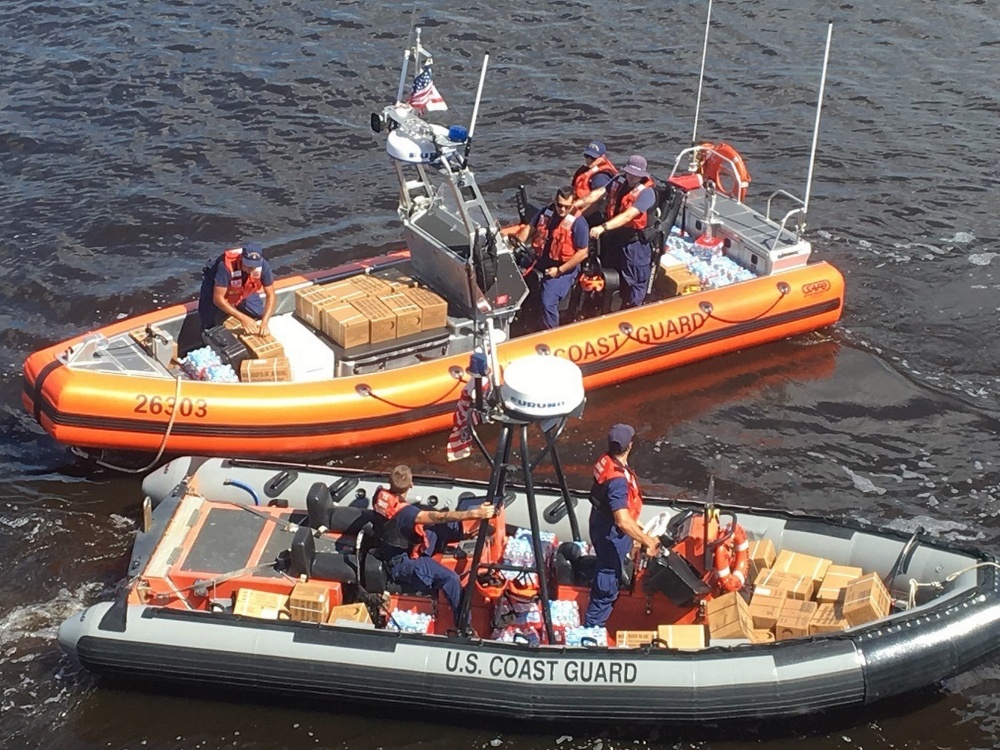 Crew members from Coast Guard Cutter Diligence, homeported in Wilmington, North Carolina, prepare to deliver supplies to people affected by Hurricane Florence in Wilmington, Sept. 19, 2018. The crew began their 60-day patrol deterring migrants in the Windward Passage, then provided aid to people in North Carolina and Florida after Hurricanes Florence and Michael. (U.S. Coast Guard photo, courtesy Cutter Diligence/Released) Crew members from Coast Guard Cutter Diligence, homeported in Wilmington, North Carolina, prepare to deliver supplies to people affected by Hurricane Florence in Wilmington, Sept. 19, 2018. The crew began their 60-day patrol deterring migrants in the Windward Passage, then provided aid to people in North Carolina and Florida after Hurricanes Florence and Michael. (U.S. Coast Guard photo, courtesy Cutter Diligence/Released)